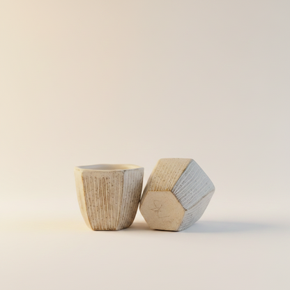 The Sandstone Pair ceramic cups — detail view, textured surface and considered form
