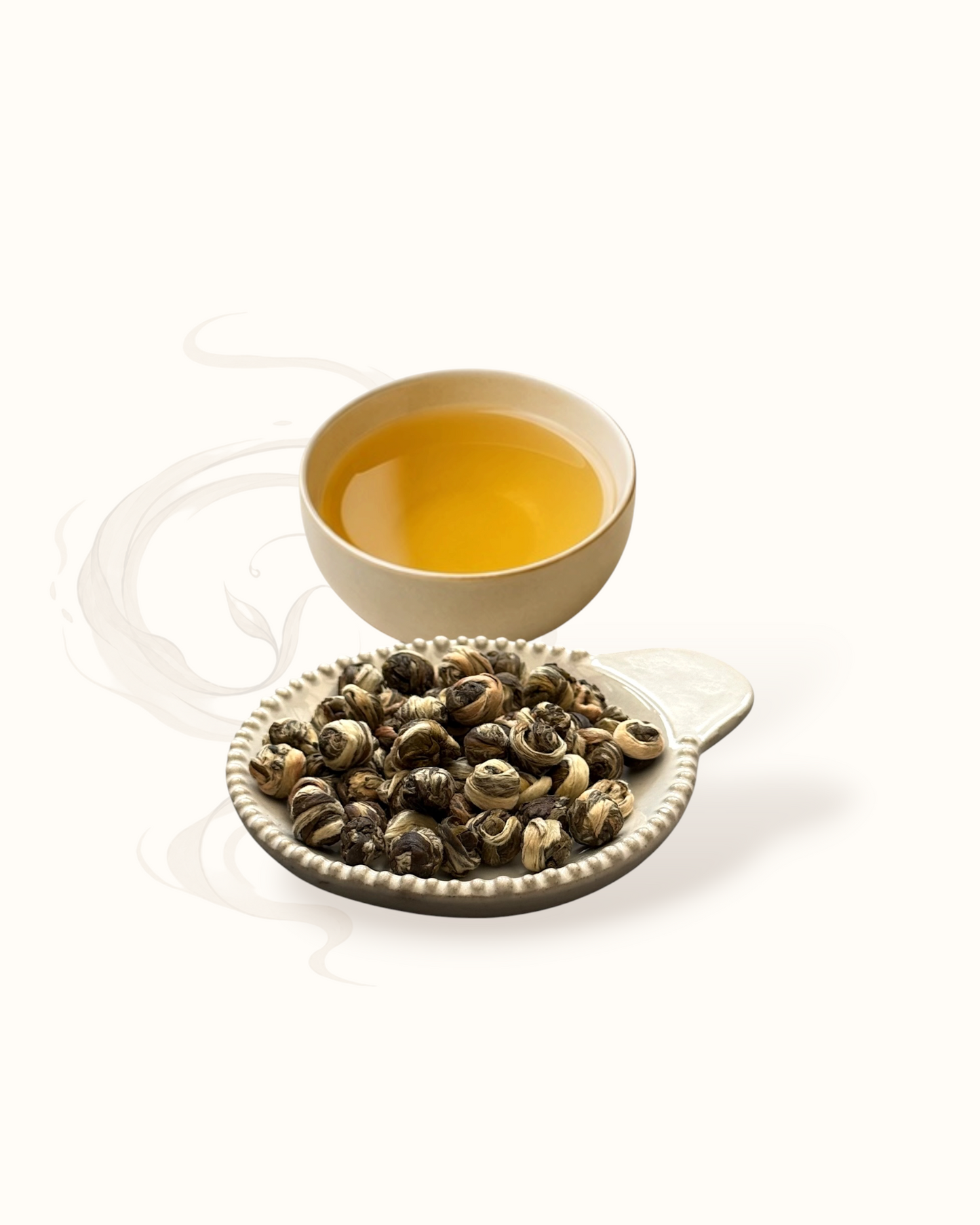 Jasmine Pearl tea leaves in a bowl with a cup of tea