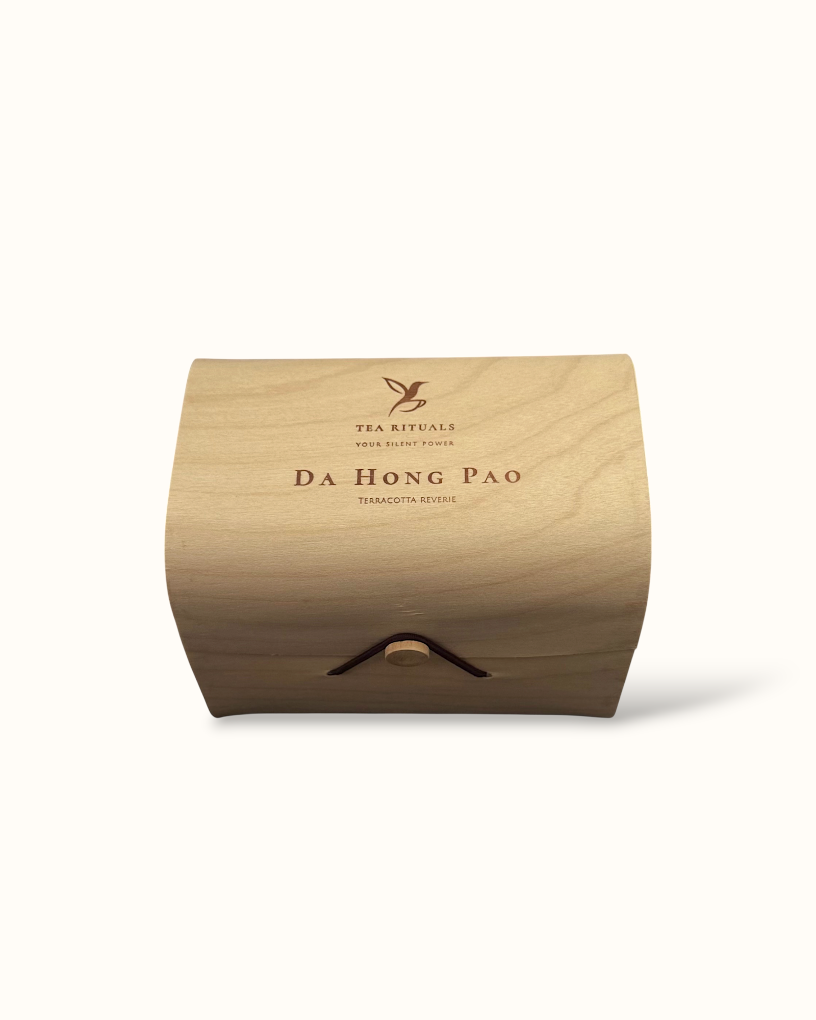 Da Hong Pao oolong tea birch wood tea box on a light background

