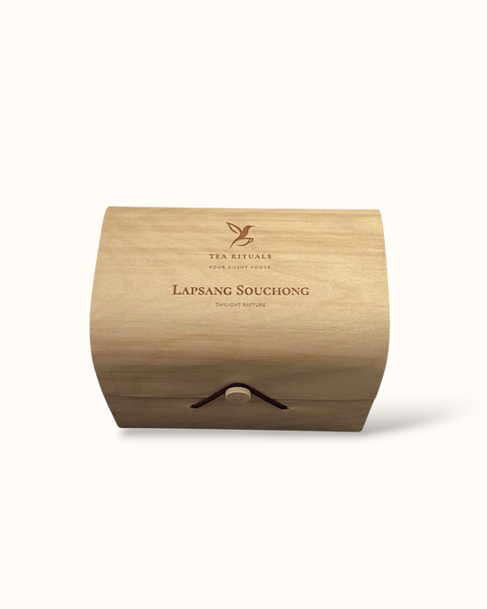 Lapsang Souchong black tea birch wood tea box on a light background

